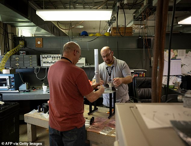 Because Wi-Fi signals use the same radio frequencies as the cosmic waves the telescope listens for, having active Wi-Fi nearby creates interference that drowns out the faint signals from space - making it impossible for scientists to do their work (pictured: scientists at Observatory)