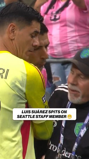 Luis Suarez appeared to spit on a rival coach