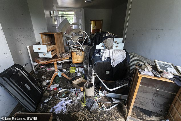 Flood high tide marks were seen over five-foot high in Maureen's front room