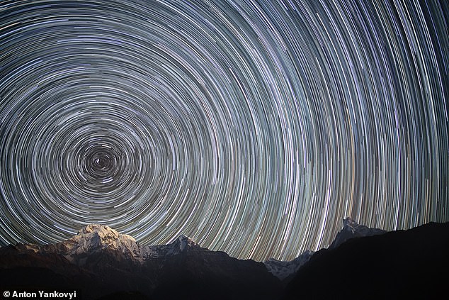 This long-exposure photo of the northern night sky above the Nepali Himalayas shows the apparent paths of the stars as Earth rotates. If Earth spun fast enough, is this what we would see?