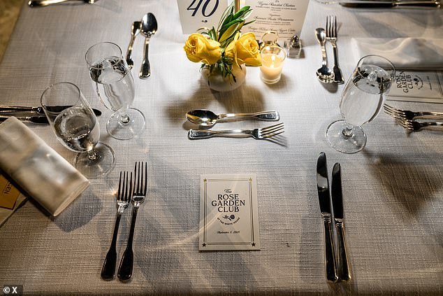 Cards titled 'The Rose Garden Club' were placed on elegantly designed tables at the event