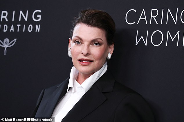 She combed back her hair away from her face and added flashy silver earrings for a finishing touch to the ensemble