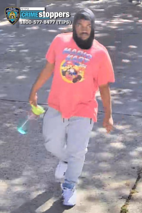 A man wanted by NYPD Crime Stoppers wearing a red "Mario Kart" shirt.