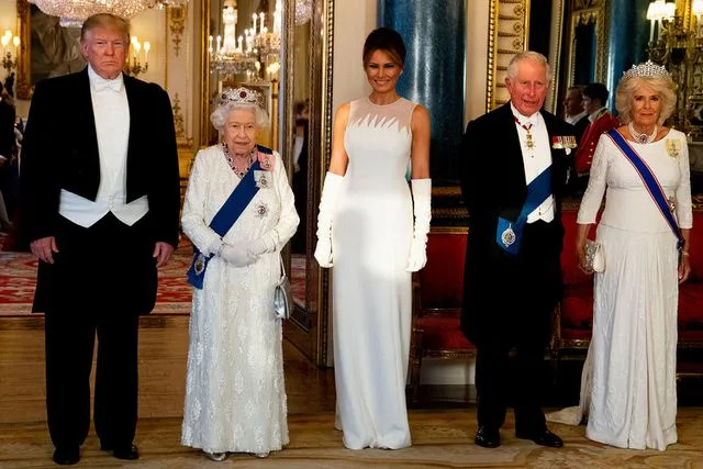 DOUG MILLS/POOL/AFP via Getty Donald Trump, Queen Elizabeth, Melania Trump, then-Prince Charles and the future Queen Camilla before the state banquet at Buckingham Palace on June 3, 2019.