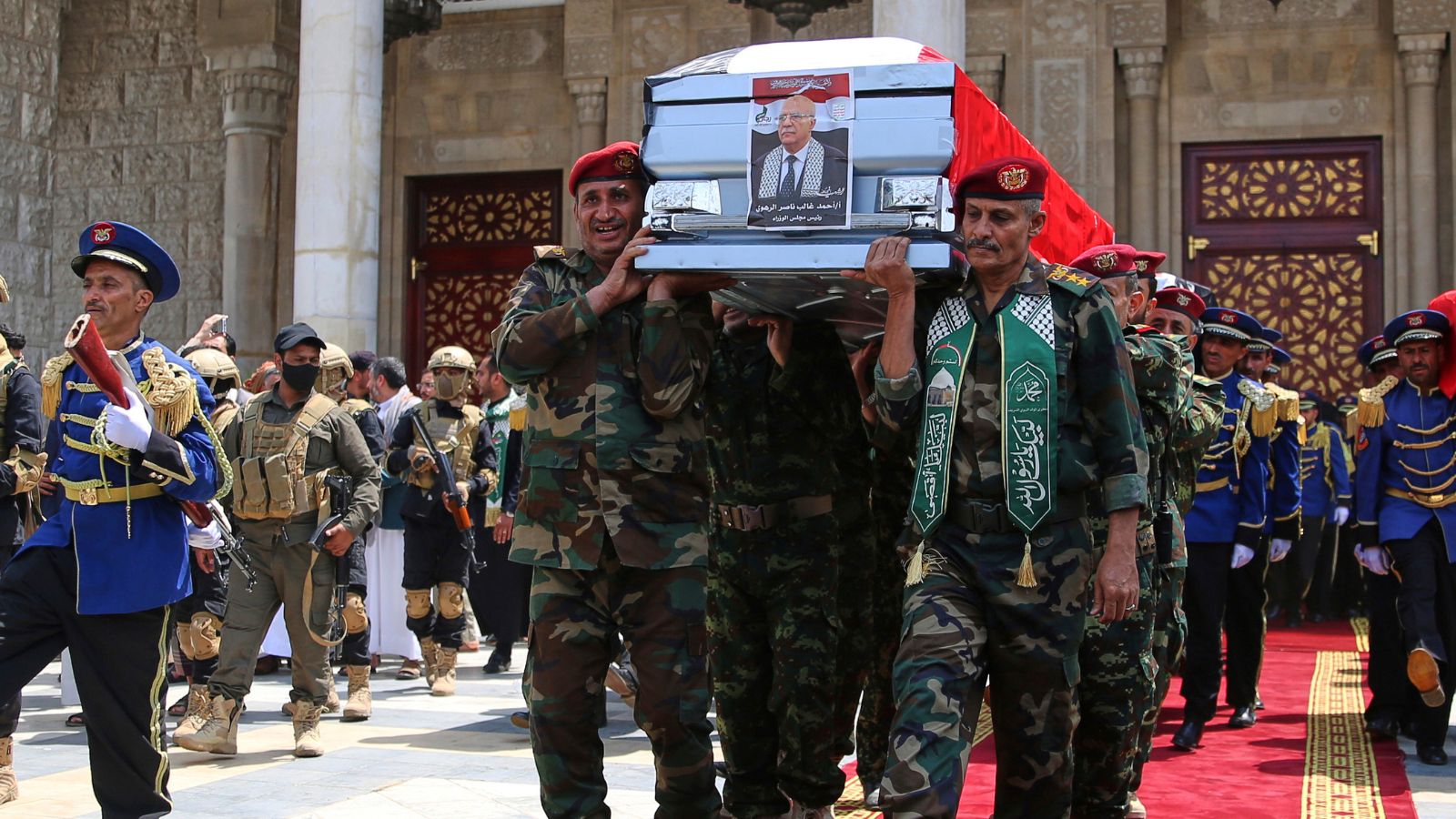 Houthi officers carry the coffin of Houthi Prime Minister Ahmed al-Rahawi, who was killed along with others in Israeli airstrikes on Thursday, out of the Shaab Mosque during his funeral in Sanaa, Yemen, Monday, Sept. 1, 2025. (AP Photo/Osamah Abdulrahman)