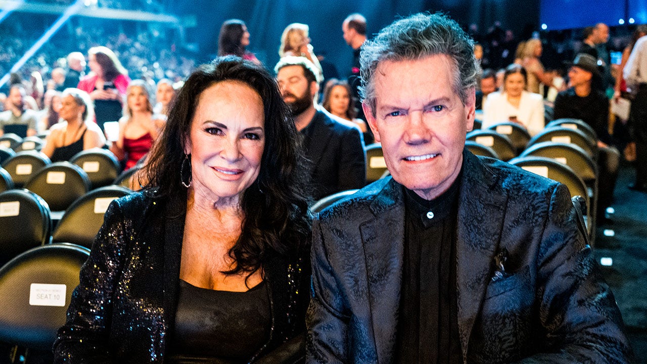 Randy Travis' wife says he still calls her 'hot mama'