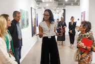 Valerie Gillespie talks about her Pencil on Paper gallery to a tour group with Gail Sachson...