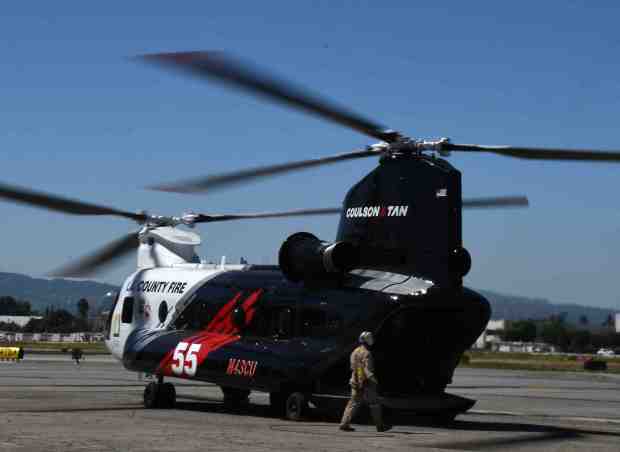 Coulson Chinook CH-47, known as Helitanker 55 fire up their...
