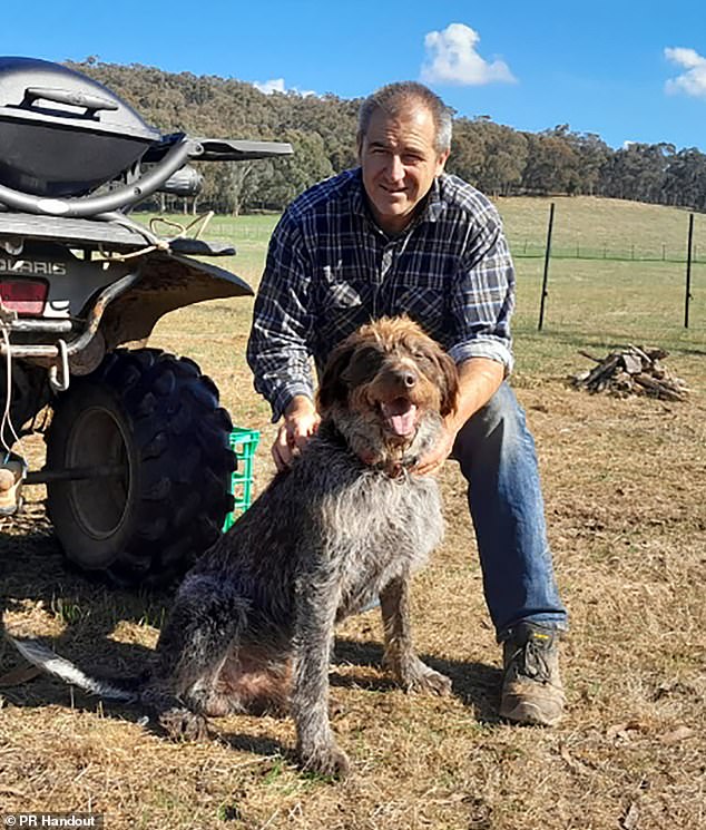 In an undated supplied image obtained on Wednesday, August 27, 2025, detective Leading Senior Constable Neal Thompson, posed for a photo with a dog in, Australia. The police officers killed in a shooting at a property in Victoria's high country have been remembered as heroes who paid the ultimate sacrifice. (PR HANDOUT/Supplied by Victoria Police) NO ARCHIVING, EDITORIAL USE ONLY, AAP PROVIDES ACCESS TO THIS HANDOUT IMAGE TO BE USED SOLELY FOR THE PURPOSE FOR WHICH THE IMAGE WAS PROVIDED - FOR REPORTING ON THE EVENTS OR FACTS DEPICTED IN THE IMAGE. 15049497