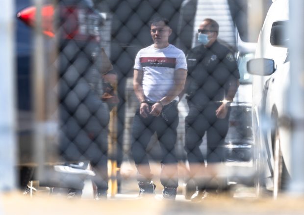 A detainee is brought into the Immigration and Customs Enforcement...