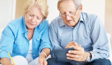 Portrait of a retired senior couple calculating their personal finances at home.