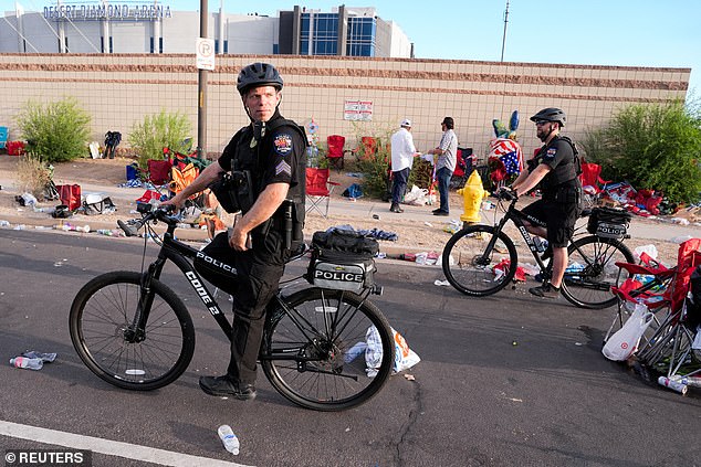 Police officers ride bicycles outside State Farm Stadium, on the day of a memorial service for slain conservative commentator Charlie Kirk, in Glendale, Arizona, U.S., September 21, 2025.Â  REUTERS/Cheney Orr