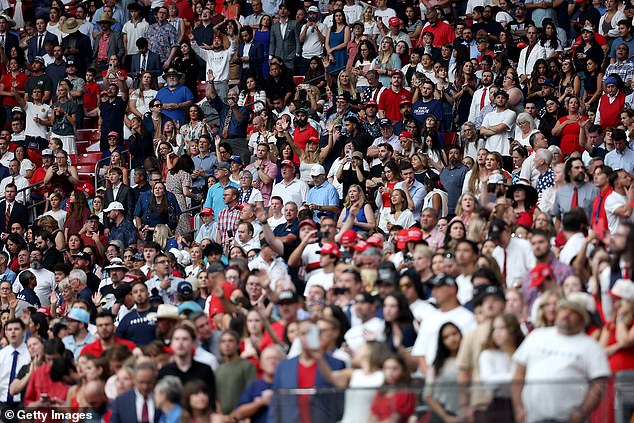 GLENDALE, ARIZONA - SEPTEMBER 21: Attendees await the start of the memorial service for political activist Charlie Kirk at State Farm Stadium on September 21, 2025 in Glendale, Arizona. Kirk, the CEO and co-founder of Turning Point USA, was shot and killed on September 10th while speaking at an event during his "American Comeback Tour" at Utah Valley University. (Photo by Eric Thayer/Getty Images)