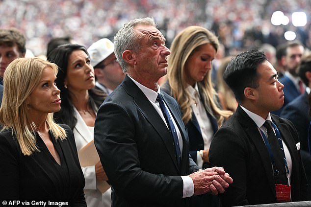 US Secretary of Health and Human Services Robert F. Kennedy Jr. (R) attends the public memorial service for right-wing activist Charlie Kirk at State Farm Stadium in Glendale, Arizona, on September 21, 2025. (Photo by Mandel NGAN / AFP) (Photo by MANDEL NGAN/AFP via Getty Images)