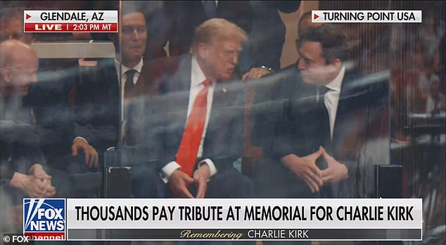 Donald Trump and Elon Musk converse during Charlie Kirk memorial serive at Glendale AZ