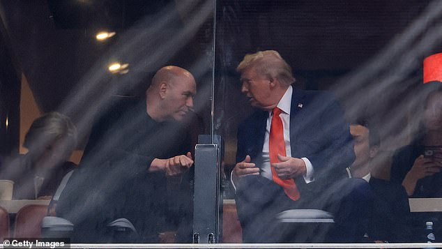 GLENDALE, ARIZONA - SEPTEMBER 21: UFC CEO Dana White (L) speaks with U.S. President Donald Trump at the memorial service for political activist Charlie Kirk at State Farm Stadium on September 21, 2025 in Glendale, Arizona. Kirk, the CEO and co-founder of Turning Point USA, was shot and killed on September 10th while speaking at an event during his "American Comeback Tour" at Utah Valley University. (Photo by Joe Raedle/Getty Images)