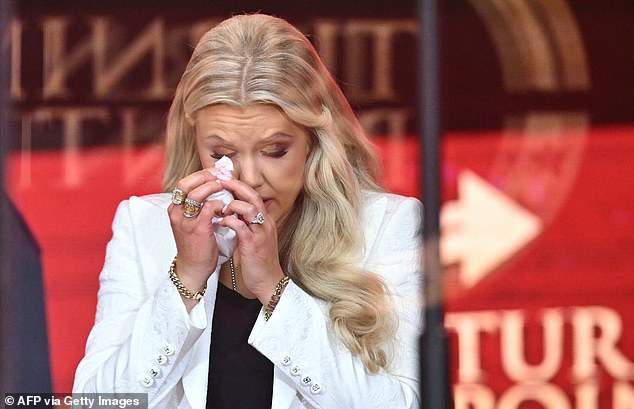 Erika Kirk, Charlie Kirk's widow, wipes away tears as she speaks at the public memorial service for right-wing activist Charlie Kirk at State Farm Stadium in Glendale, Arizona, on September 21, 2025. (Photo by Mandel NGAN / AFP) (Photo by MANDEL NGAN/AFP via Getty Images)