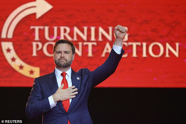 U.S. Vice President JD Vance pumps a fist after speaking during a memorial service for slain conservative commentator Charlie Kirk at State Farm Stadium, Arizona, U.S., September 21, 2025.  REUTERS/Carlos Barria