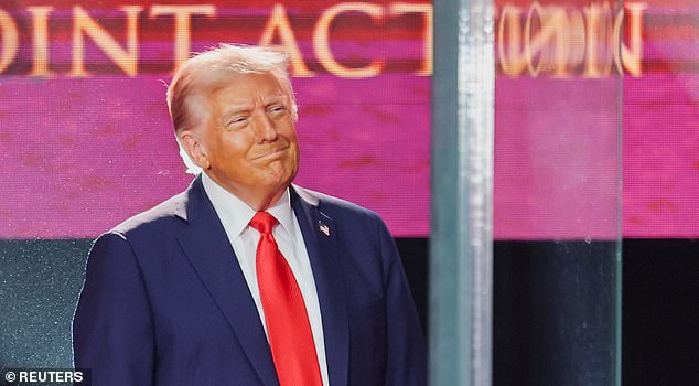 U.S. President Donald Trump appears onstage during a memorial service for slain conservative commentator Charlie Kirk at State Farm Stadium, in Glendale, Arizona, U.S., September 21, 2025.  REUTERS/Daniel Cole