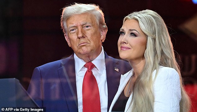 US President Donald Trump greets Erika Kirk, Charlie Kirk's widow during the public memorial service for right-wing activist Charlie Kirk at State Farm Stadium in Glendale, Arizona, on September 21, 2025. (Photo by Mandel NGAN / AFP) (Photo by MANDEL NGAN/AFP via Getty Images)