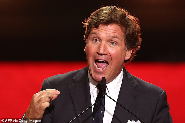 US political commentator Tucker Carlson speaks during the public memorial service for right-wing activist Charlie Kirk at State Farm Stadium in Glendale, Arizona, on September 21, 2025. (Photo by Patrick T. Fallon / AFP) (Photo by PATRICK T. FALLON/AFP via Getty Images)