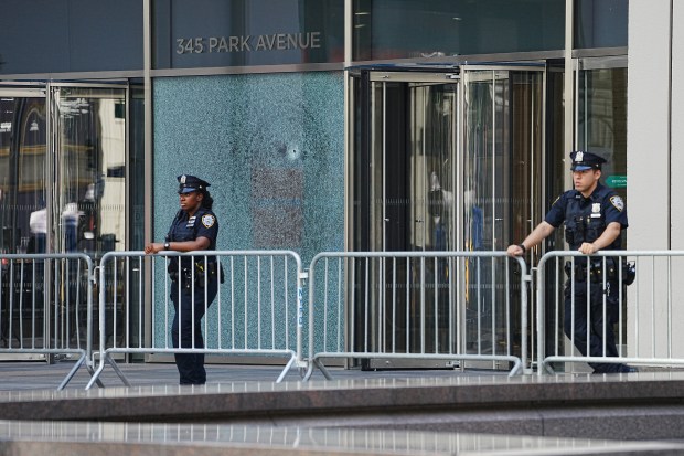 NYPD police officers are pictured outside 345 Park Ave. on Tuesday, July 29, 2025 in New York City, after a shooting inside the office building a day earlier. (Barry Williams / New York Daily News)