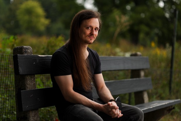 Keith Kohn, co-founder of Save the Night and a musician in the metal band Ruinous Time Blade, on a bench in Humboldt Park, Sept. 23, 2025. Save the Night is a volunteer-led COVID-conscious collective focusing on creating and facilitating safer environments for audiences and performers. Save the Night plans to host an outdoor festival in Humboldt Park in the spring. (Eileen T. Meslar/Chicago Tribune)