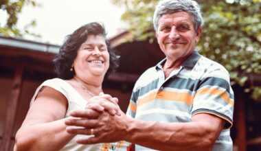 Happiness Expressed By Senior Husband And Wife Through Outdoor Dance In Backyard stock photo