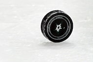 The puck rolls the length of the ice after an officials whistle during the Dallas Stars...