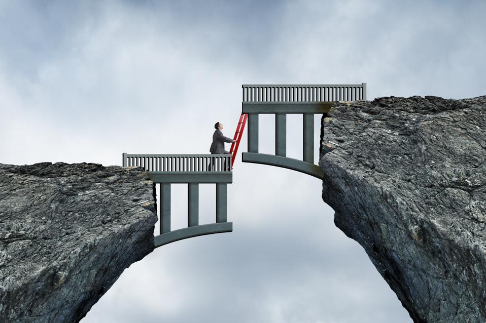 Man placing a ladder against a misaligned bridge, symbolizing bridging career gaps.
