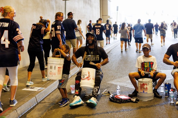 People drum on buckets as Chicago Bears and Las Vegas...