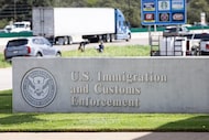 A sign outside of the main entrance to the Dallas Immigration and Customs Enforcement office...