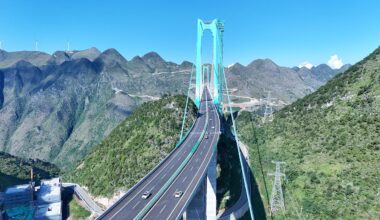 China opens world's reported largest span bridge over Beipan River valley to traffic