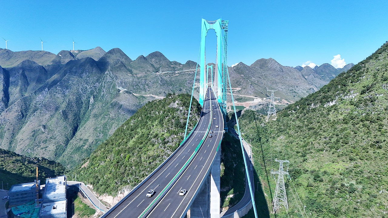 China opens world's reported largest span bridge over Beipan River valley to traffic