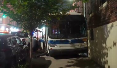 NYC bus collides with car then crashes into apartment building in Bay Ridge, Brooklyn