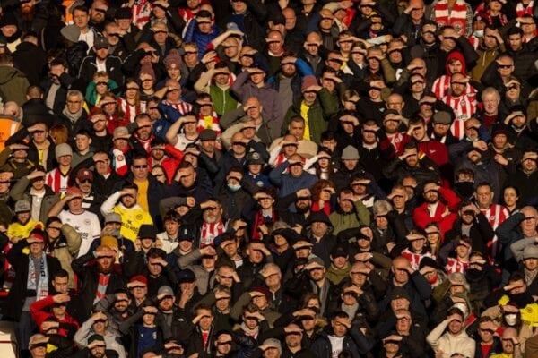 LIVERPOOL, ENGLAND - Sunday, January 16, 2022: Brentford supporters shield their eyes from the sun during the FA Premier League match between Liverpool FC and Brentford FC at Anfield. Liverpool won 3-0. (Pic by David Rawcliffe/Propaganda)