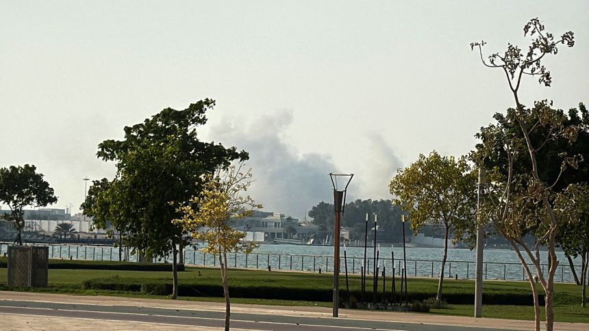 Smoke rises after several blasts were heard in Doha, Qatar, on Tuesday.