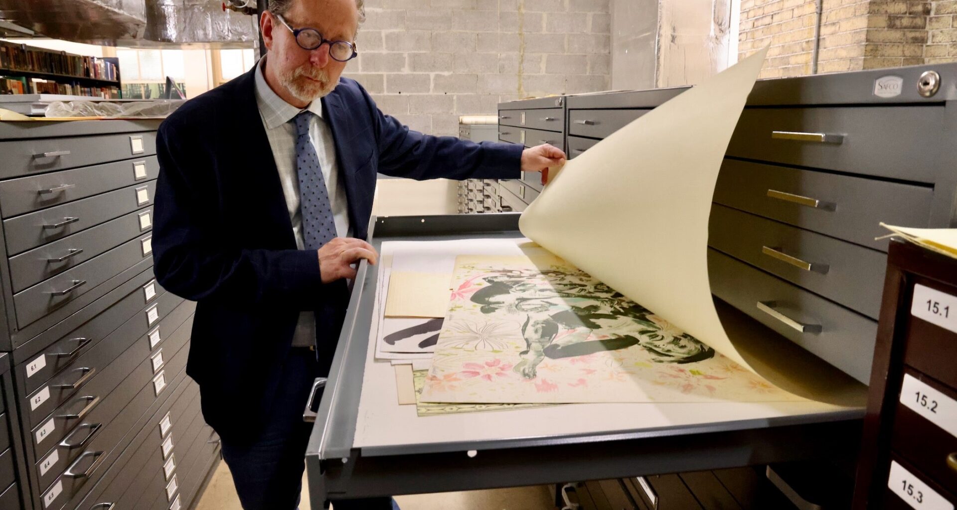 Historical Society of Pennsylvania CEO David Brigham looks at a print