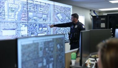 A Phoenix Police officer points to a map on a screen at one of the department’s Real Time Operations Centers. Touting the RTOCs success in reducing crime, members of the Phoenix Public Safety and Justice Subcommittee urged staff to explore expanding the two existing RTOCs to 24/7 operations as well as adding more RTOCs throughout the city.