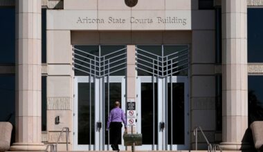 FILE - A man enters the Arizona Supreme Court building, Wednesday, April 10, 2024, in Phoenix. (AP Photo/Matt York, File)