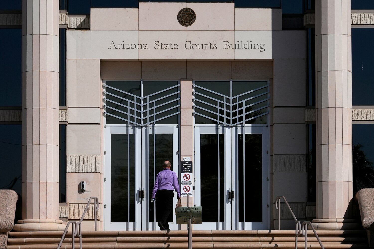 FILE - A man enters the Arizona Supreme Court building, Wednesday, April 10, 2024, in Phoenix. (AP Photo/Matt York, File)
