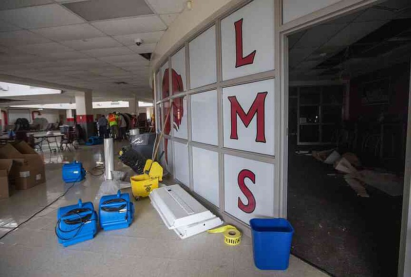 The interior of Lingle Middle School in Rogers is seen May 31, 2024, as staff members helped clean up following a storm earlier that week that  caused major damage to the school. The Rogers School District subsequently closed the building for the 2024-25 school year. (Photo by Jason Ivester/Courtesy of the Rogers School District)