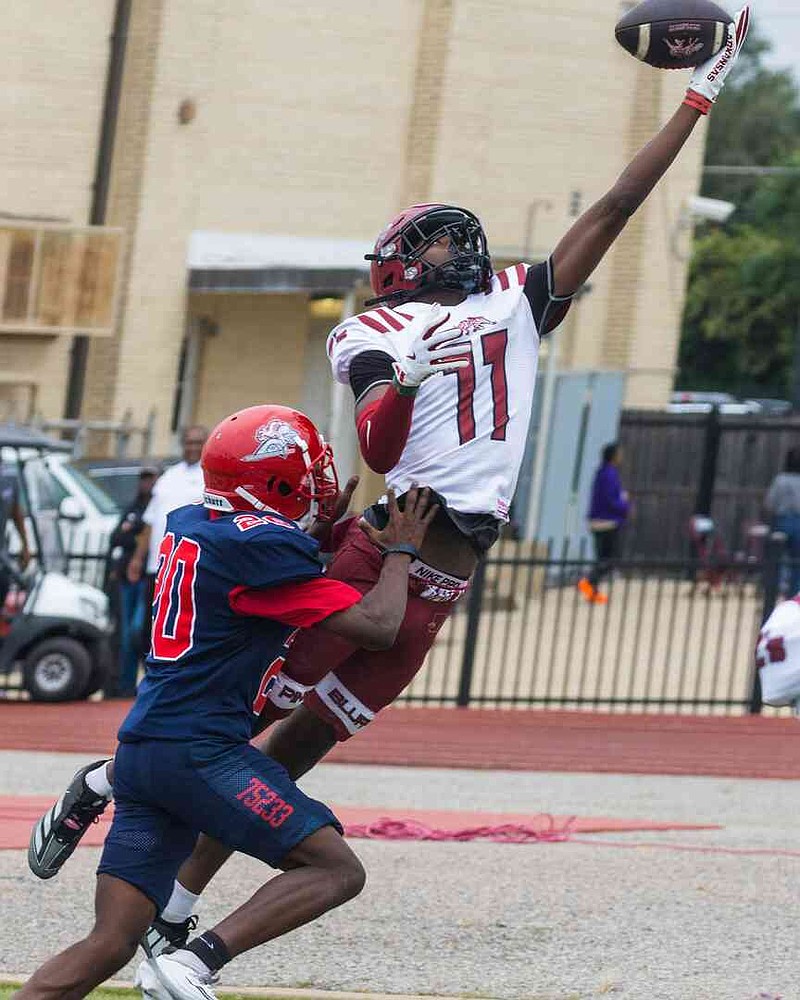 Pine Bluff High School receiver Rashawn Reed one-hands a catch on a 2-point conversion attempt as Dallas Kimball defensive back Jadarius Jennings covers Saturday, Sept. 6, 2025, in Dallas. The catch was called back, however, for a penalty. (Special to The Commercial/Tommy Brown)