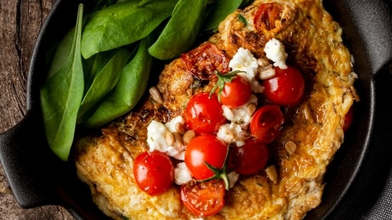 Omelettes are a protein-packed breakfast option; try adding veggies like cherry tomatoes and spinach for extra nutrients. Jessie's favourite is an omelette with cherry tomatoes and feta cheese. (Freepik)