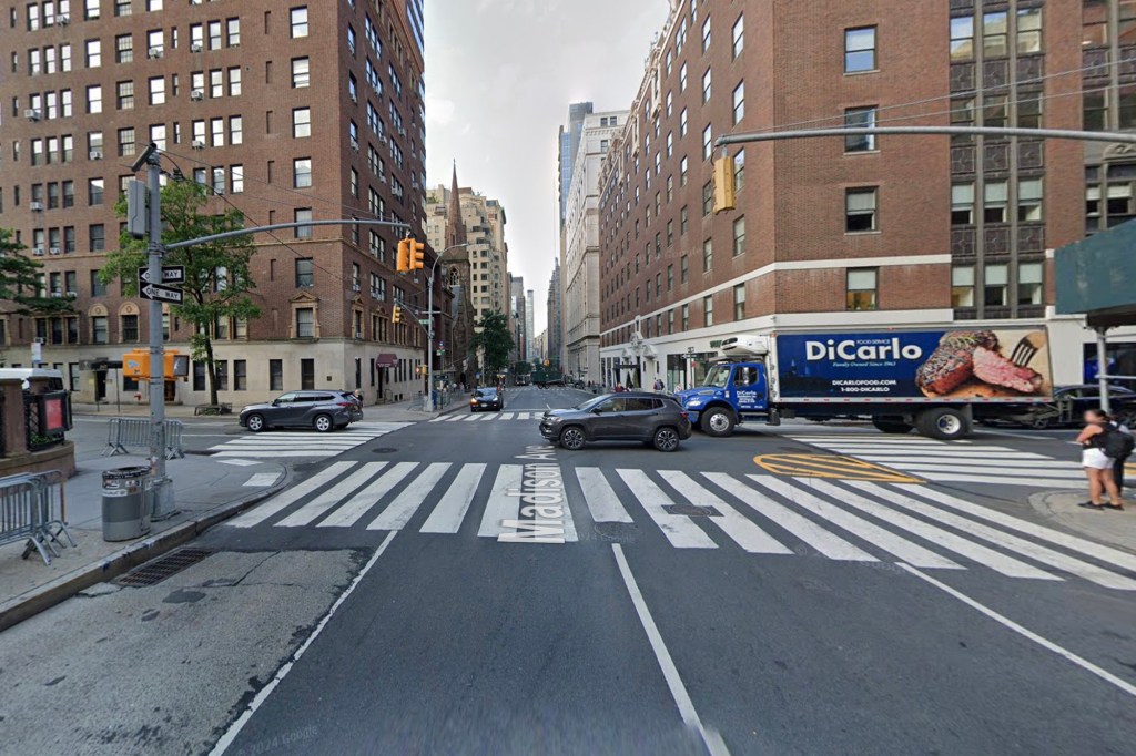 A street view of the intersection of East 36th Street and Madison Avenue in New York City, with a large blue "DiCarlo" food truck partially visible on the right.