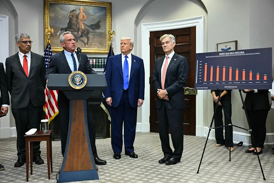 U.S. health secretary Robert F. Kennedy Jr stands in the White House with Donald Trump and other officials as they announce new measures to cut prescription drug prices (Jim Watson/AFP via Getty Images)