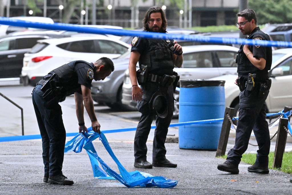 Police officers at a crime scene in Brooklyn.