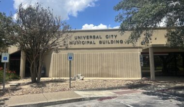 The exterior of a city administration building is shown on a partly cloudy day in Universal City, Texas.