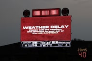 The digital scoreboard directed fans and players to safety during the first of multiple...