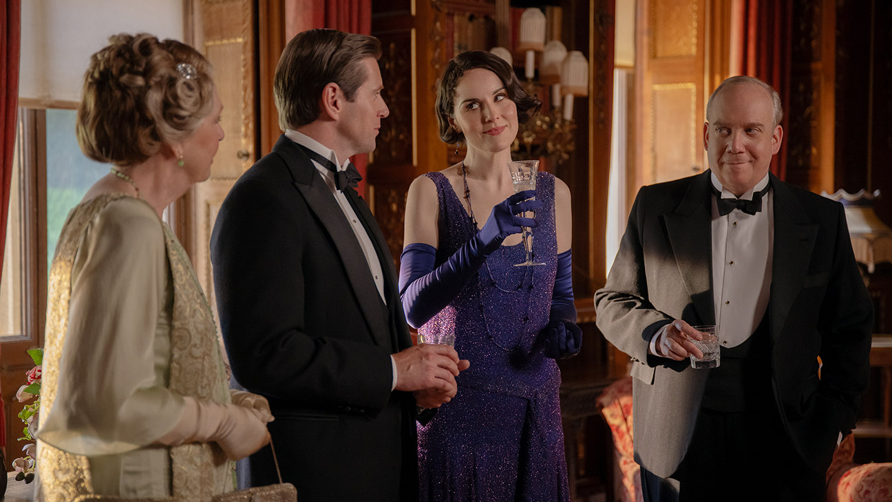 (L to R) Penelope Wilton stars as Isobel Merton, Allen Leech as Tom Branson, Michelle Dockery as Lady Mary and Paul Giamatti as Harold Levinson in Downton Abbey: The Grand Finale